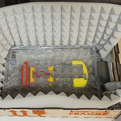 Model in plywood packaging with shock absorbing gasket